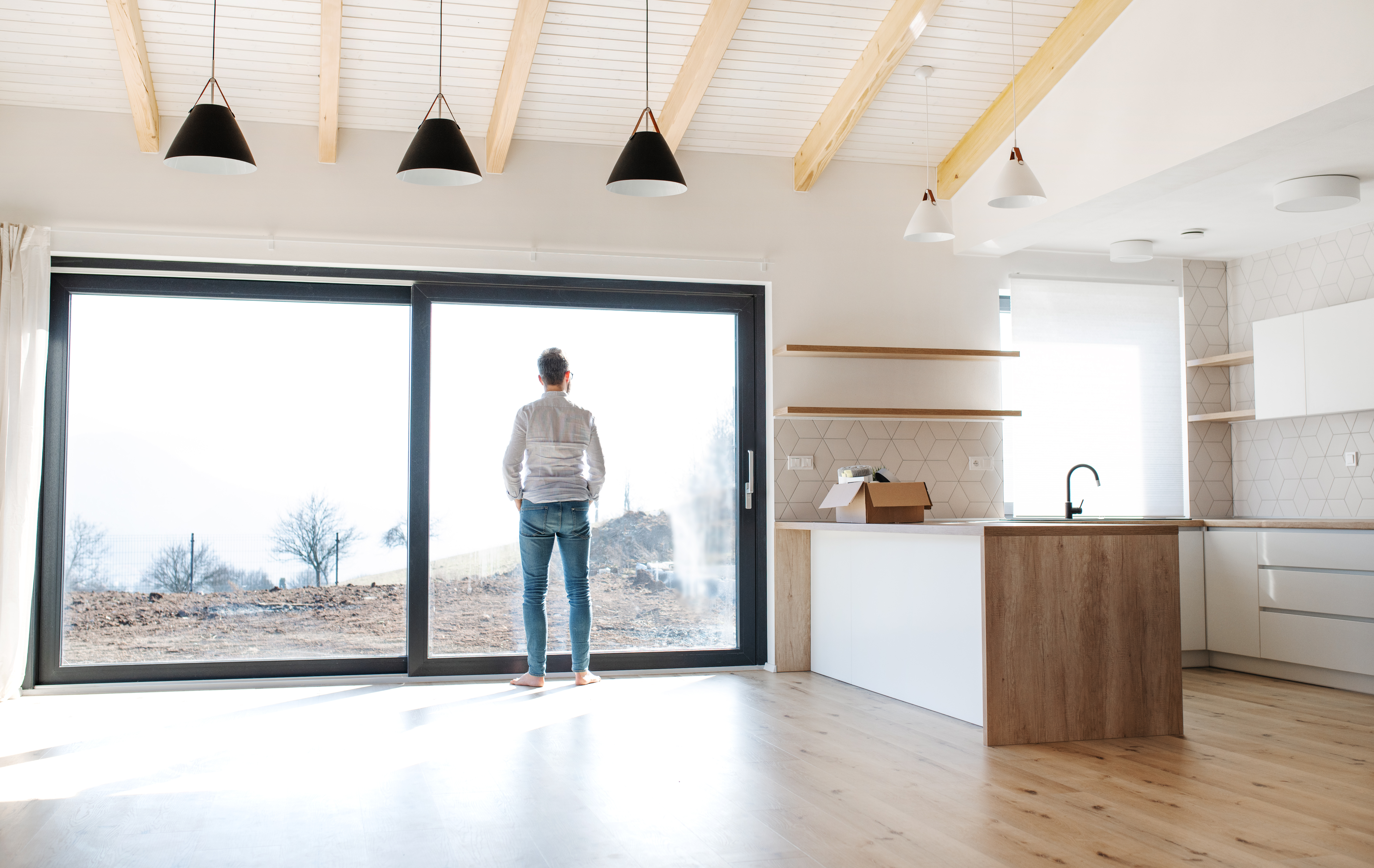 rear view of man standing in unfurnished house mo 2026 03 10 03 54 56 utc